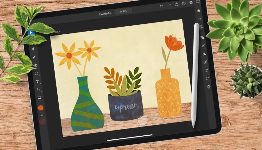 Adobe Illustrator auf dem iPad zeigt eine bunte Illustration von drei Vasen mit Blumen und Pflanzen.