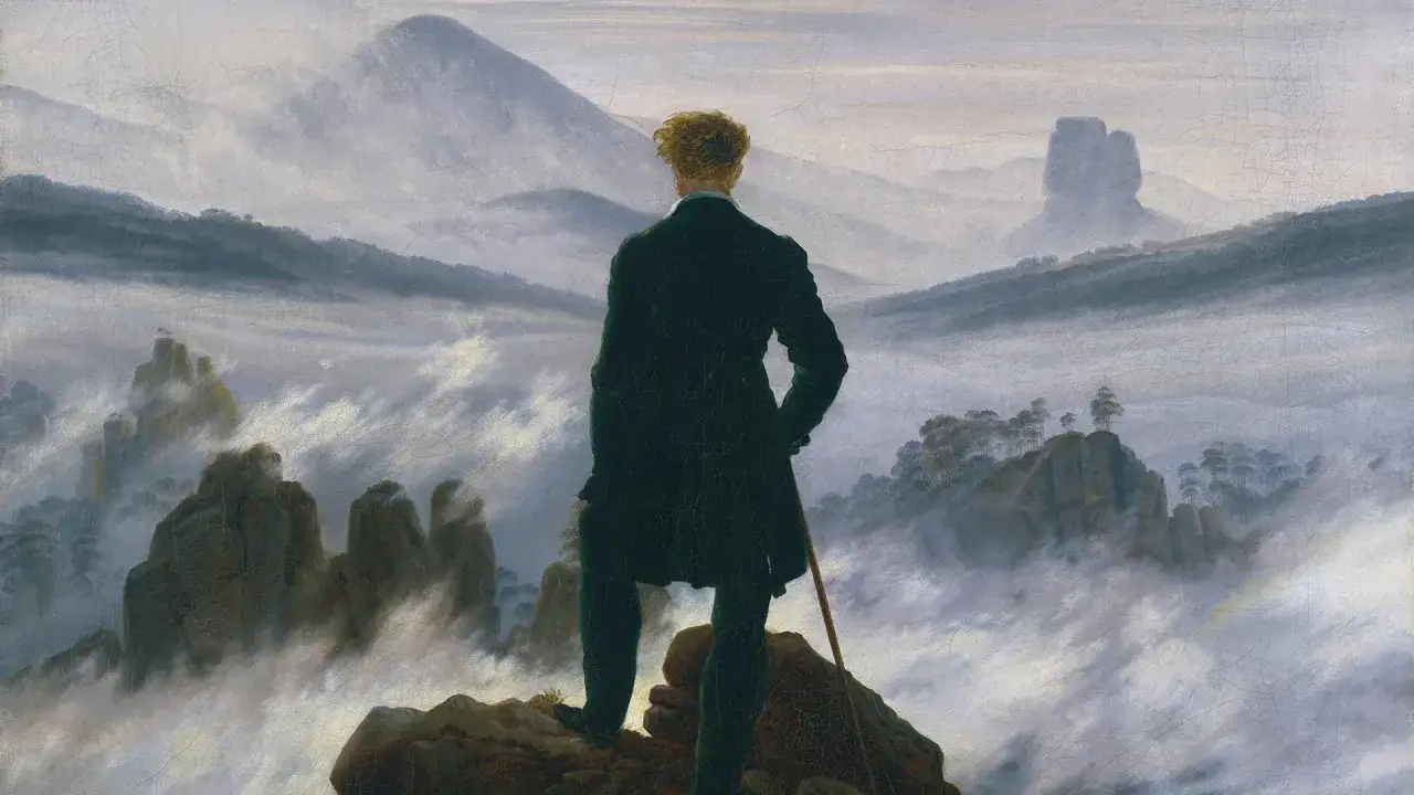 Ein Mann mit Stock steht auf einem Felsen und blickt in eine nebelverhangene Berglandschaft. Ein berühmtes Werk eines Landschaftsmalerei Künstlers.