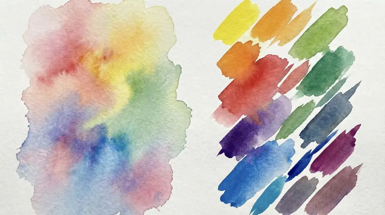 Farbverläufe und Pinselstriche in Regenbogenfarben auf weißem Papier. Eine abstrakte Darstellung, die wie eine farben mischen tabelle wirkt.